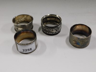 Lot 2258 - A pair of silver plated napkin rings, with...