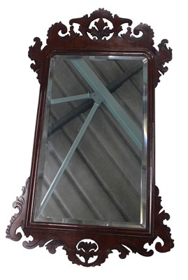 Lot 595 - A mahogany fret framed wall mirror, in mid...