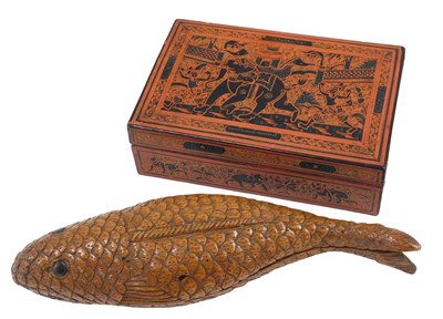 Lot 604 - An Eastern carved wooden fish shaped box and...