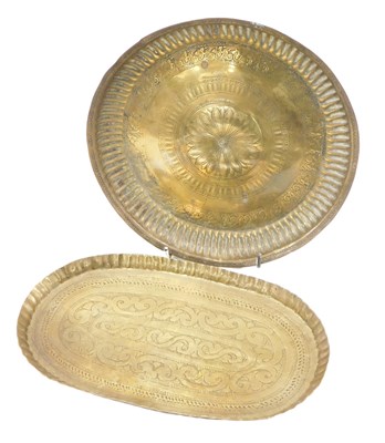 Lot 629 - A small embossed and engraved brass tray or...