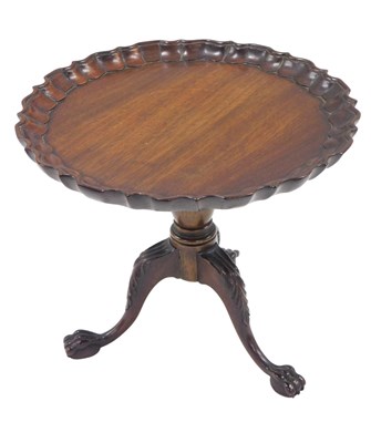 Lot 630 - A miniature mahogany pie crust tilt top...