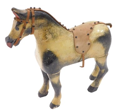 Lot 633 - A carved wooden dapple grey toy horse, with...