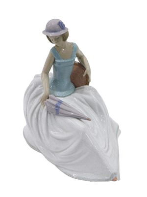 Lot 464 - A Nao porcelain figure, of a lady wearing a...