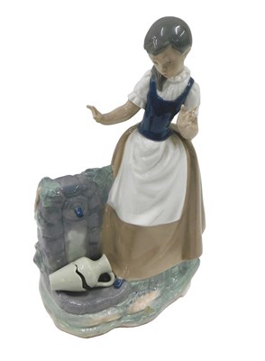 Lot 509 - A Nao porcelain figure, of a young girl...