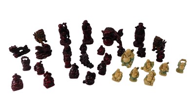 Lot 636 - A quantity of Oriental resin figures, dogs of...