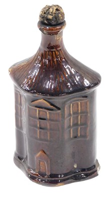 Lot 473 - A 19thC treacle glazed flask, modelled in the...