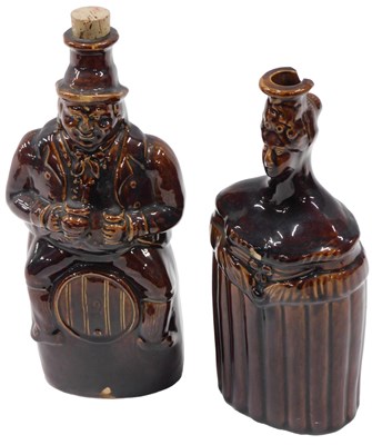 Lot 475 - An early 19thC treacle glazed flask, modelled...