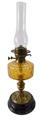 Lot 171 - A Victorian oil lamp, with amber tinted glass...