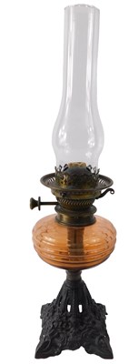 Lot 649 - A Victorian oil lamp, with red tinted glass...
