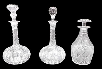 Lot 169 - A pair of bottle shaped decanters, with...