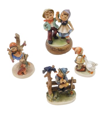 Lot 496 - Three Goebel Hummel figures, to include boy on...