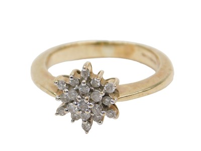 Lot 428 - A 9ct gold and diamond set flower head ring,...