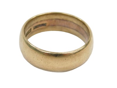 Lot 426 - A 9ct gold wide wedding band, size R½, 7.3g.