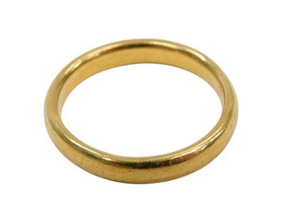 Lot 853 - A 22ct gold wedding band, size R, 6.4g.