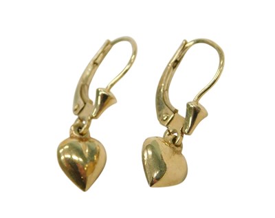 Lot 849 - A pair of heart shaped drop earrings, in claw...