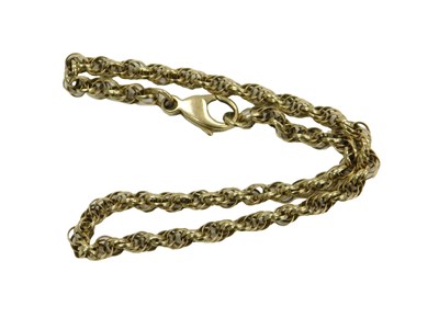 Lot 61 - A triple circular link bracelet, on a lobster...