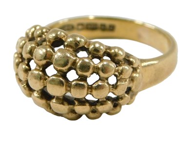 Lot 63 - A 9ct gold keeper ring, size J, 3.6g.