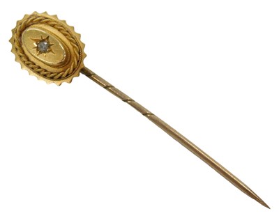 Lot 64 - A Victorian diamond set stick pin, of oval...