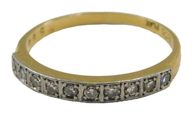Lot 81 - A diamond half hoop eternity ring, channel set...