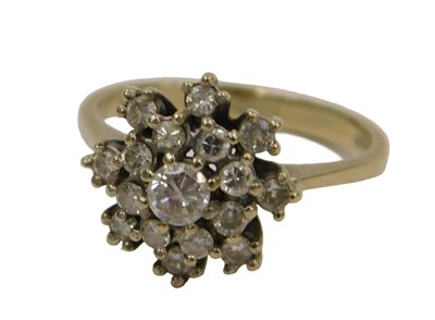 Lot 84 - An 18ct gold and diamond flower head ring,...