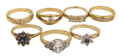 Lot 90 - Seven gold plated and paste set dress rings,...