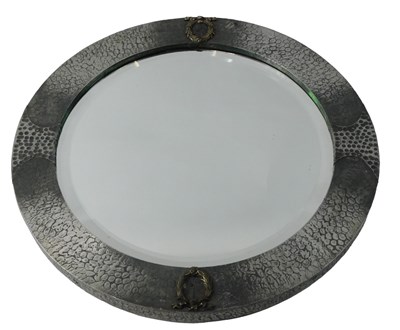 Lot 877 - An early 20thC hammered pewter circular wall...