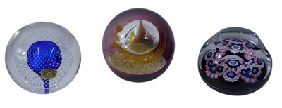 Lot 897 - Three 20thC glass paperweights, to include a...
