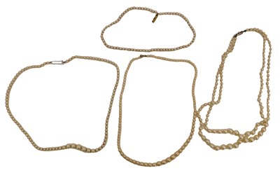 Lot 92 - A double strand simulated pearl necklace, and...