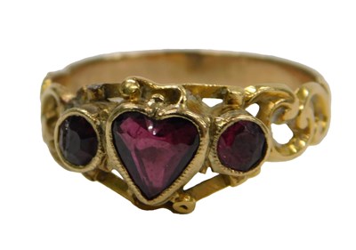 Lot 413 - A Victorian garnet three stone ring, with a...