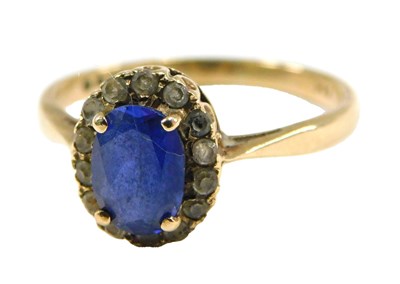 Lot 98 - A sapphire and cz ring, the oval cut sapphire...