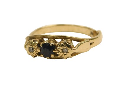 Lot 100 - A 9ct gold sapphire and diamond three stone...