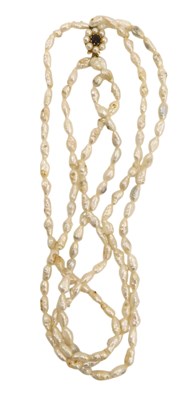 Lot 416 - A three strand natural pearl necklace, with a...
