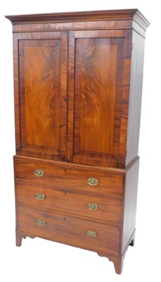 Lot 1072 - A George III mahogany clothes press, the top...