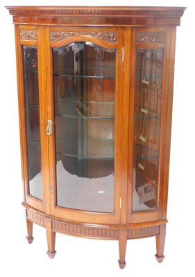 Lot 1073 - An early 20thC walnut standing corner cabinet,...