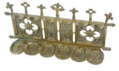 Lot 984 - A Victorian brass pipe rack, decorated with...