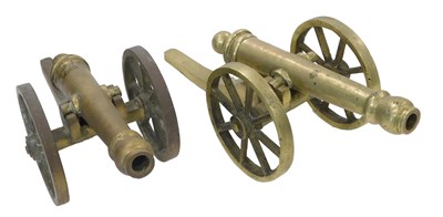 Lot 985 - Two similar brass models of cannon, 52cm long.