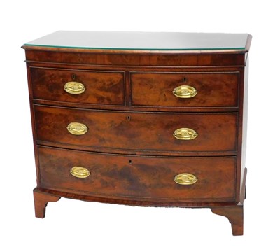 Lot 1090 - A 19thC figured mahogany bow fronted chest of...