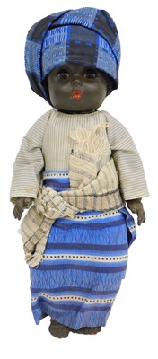 Lot 1022 - A mid century black doll, wearing traditional...