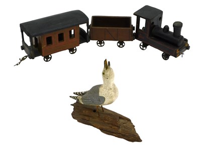 Lot 1024 - An early 20thC wooden train, tender and...