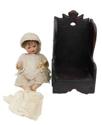 Lot 1051 - An Armand Marseille bisque doll, wearing a...