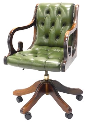 Lot 1118 - A mahogany and green studded leather office...