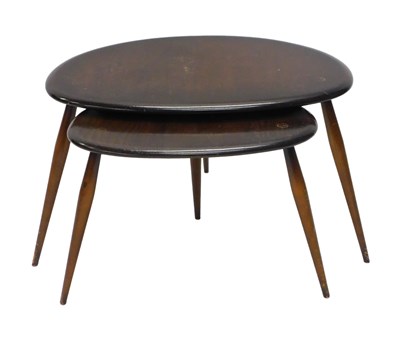 Lot 1121 - A nest of two Ercol dark stained oak...