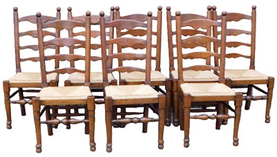 Lot 1122 - A set of eight ash and oak ladderback chairs,...