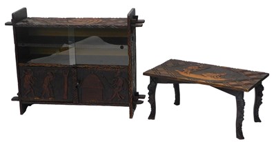 Lot 1129 - A late 20thC carved African tribal bookcase or...
