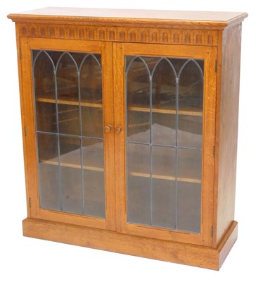Lot 1194 - An oak bookcase by David Langstaff "oak leaf...