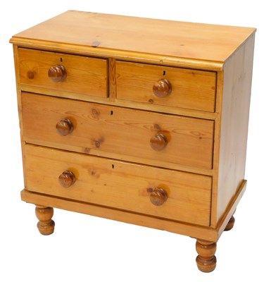 Lot 1202 - A stripped and varnished pine chest of two...