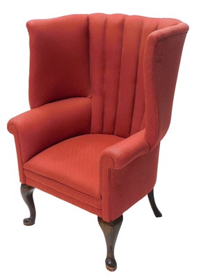 Lot 1168 - A mahogany wingback chair, in Georgian style,...
