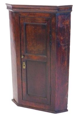Lot 1243 - An early 19thC oak hanging corner cabinet,...
