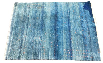 Lot 1252 - A large Persian Gabbeh rug, with a design of...
