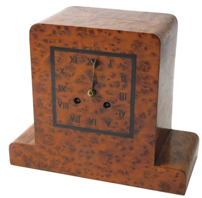 Lot 122 - A burr yew Art Deco clock, the square ebony...